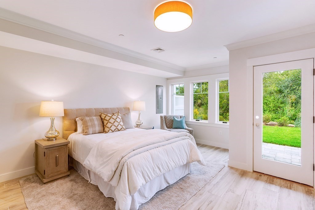 163 Atlantic Road, Unit 6 Gloucester, MA 01930 - Photo 4 of 22 a bedroom with a bed and a windows