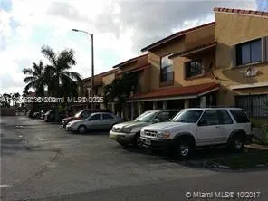 a view of street with parked cars