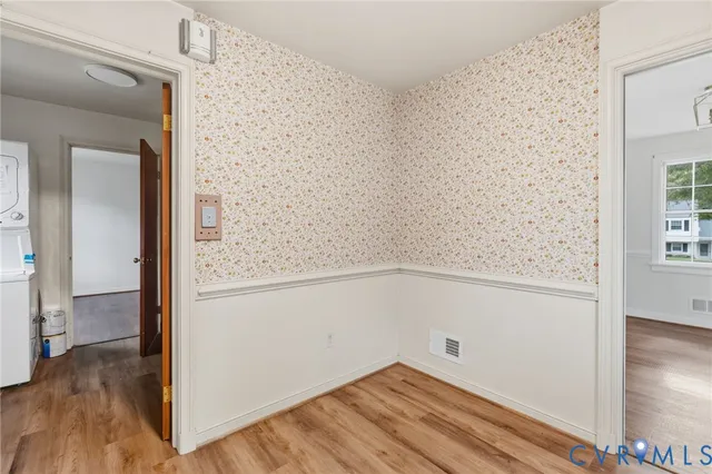 a view of a small space with wooden floor