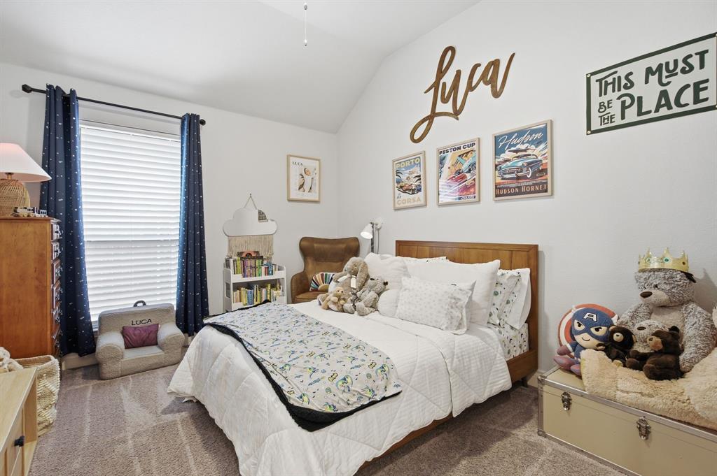 904 Fallbrook Avenue Denton, TX 76210 - Photo 22 of 30 a bedroom with a bed and a window