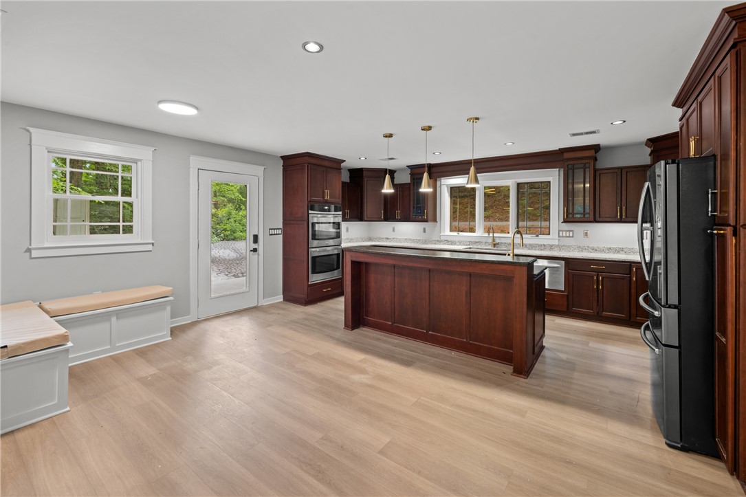 309 Woodland Way Clemson, SC 29631 - Photo 5 of 43 This spacious kitchen offers a blend of style and functionality, perfect for everyday living.