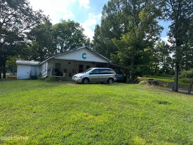 a bedroom with bed and a couch