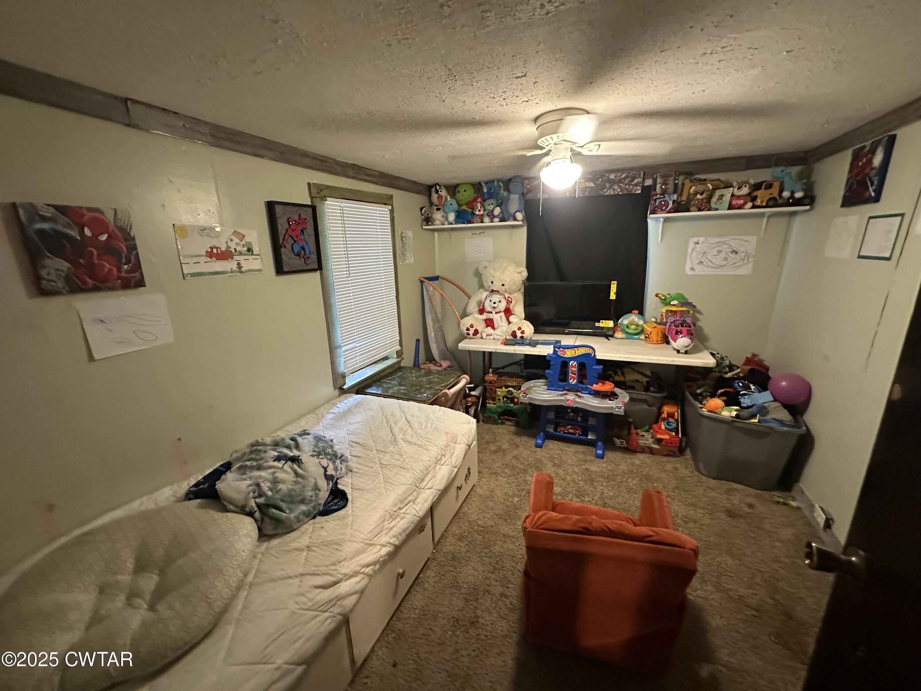 271 Fletcher Road Dyer, TN 38330 - Photo 3 of 11 a bedroom with bed and a couch