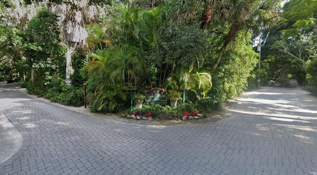 5225 Hidden Harbor Road Sarasota, FL 34242 - Photo 11 of 13 a view of a garden with a bench