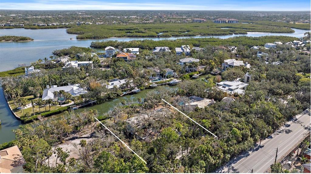 5225 Hidden Harbor Road Sarasota, FL 34242 - Photo 8 of 13 an aerial view of a houses with a lake view