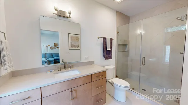 a bathroom with a toilet sink and shower