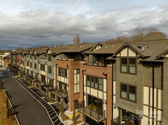 an aerial view of a residential apartment building with a yellow lightning