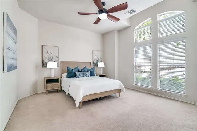 a bed room with a bed and a tv