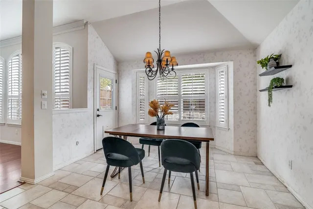 a view of a dining room with furniture and window