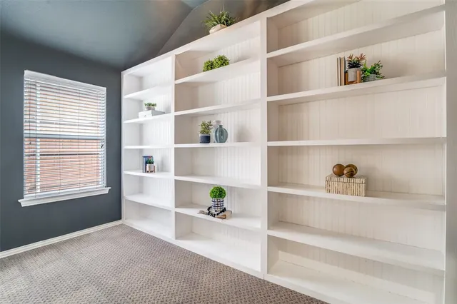 a living room with shelf
