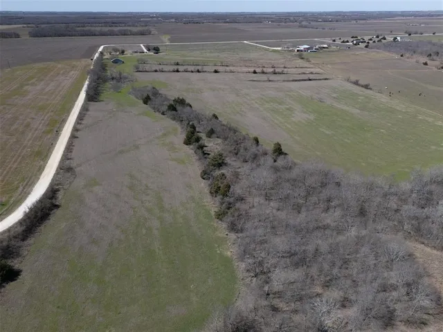 view of a dry yard with wooden fence