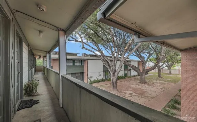 a view of a house with a tree
