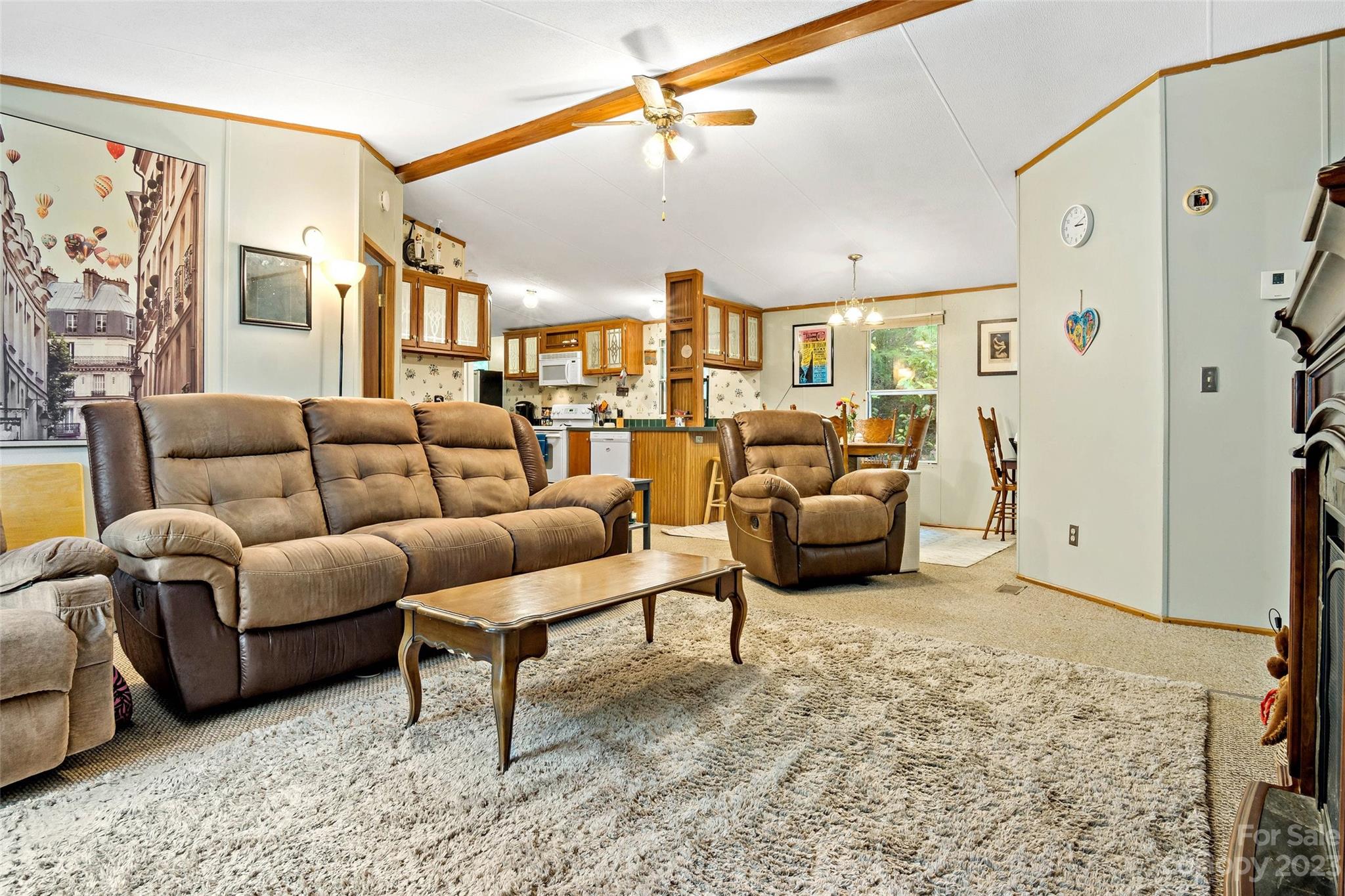 584 Ebenezer Road Old Fort, NC 28762 - Photo 12 of 41 a living room with furniture and a chandelier