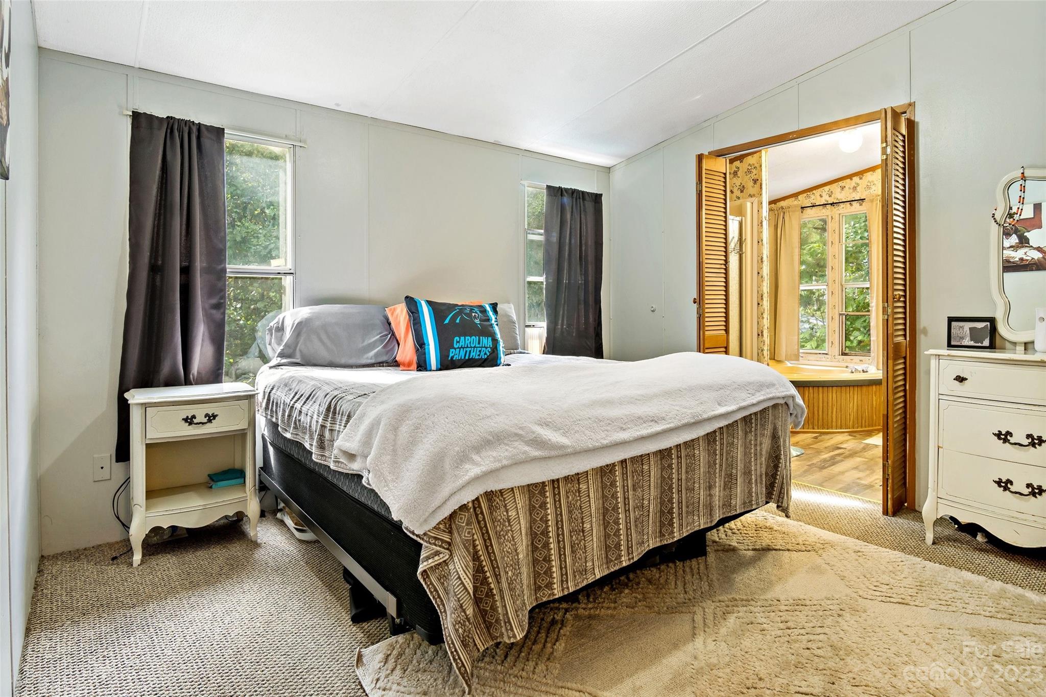 584 Ebenezer Road Old Fort, NC 28762 - Photo 19 of 41 a bedroom with a bed and a dresser