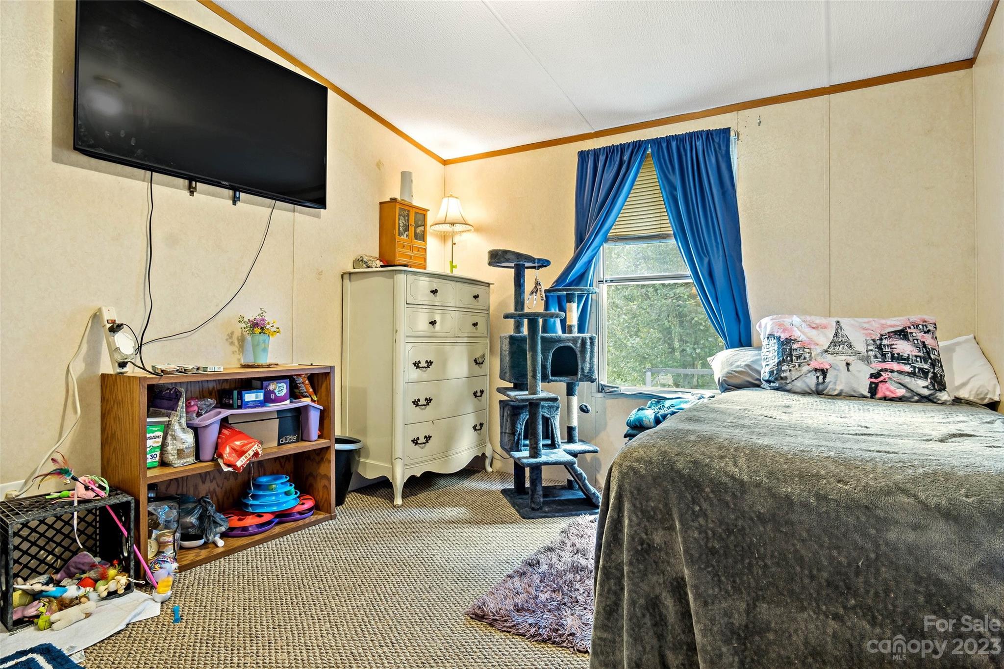 584 Ebenezer Road Old Fort, NC 28762 - Photo 26 of 41 a bedroom with a bed and a flat tv screen