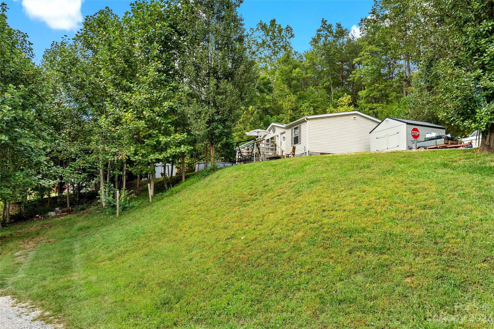 584 Ebenezer Road Old Fort, NC 28762 - Photo 31 of 41 a view of a backyard with small garden