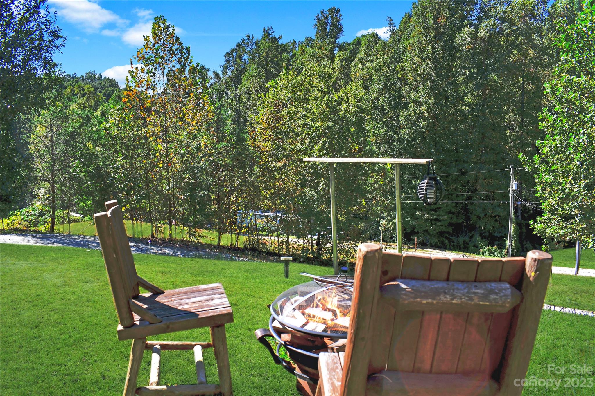 584 Ebenezer Road Old Fort, NC 28762 - Photo 32 of 41 a view of a chairs in backyard of the house