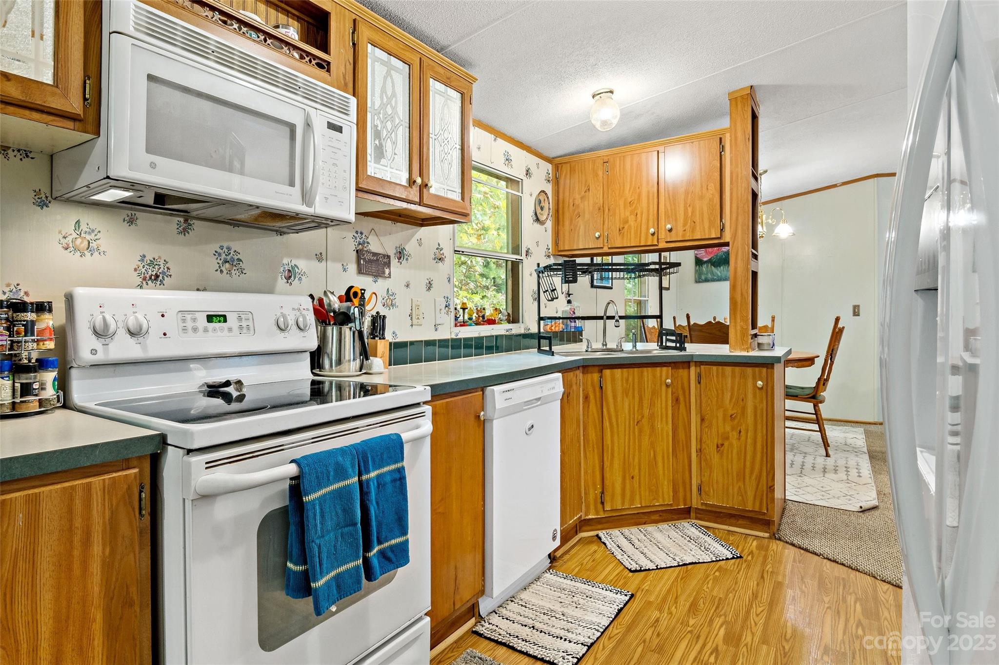 584 Ebenezer Road Old Fort, NC 28762 - Photo 6 of 41 a kitchen with stainless steel appliances granite countertop a sink and cabinets