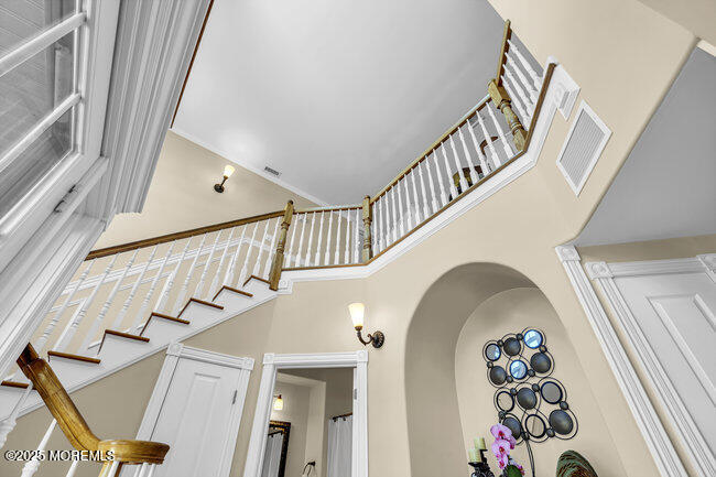 835 Anchor Drive Forked River, NJ 08731 - Photo 12 of 146 a view of staircase with lots of frames on wall and a painting