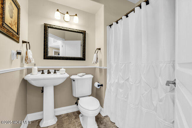 835 Anchor Drive Forked River, NJ 08731 - Photo 17 of 146 a bathroom with a toilet sink and mirror