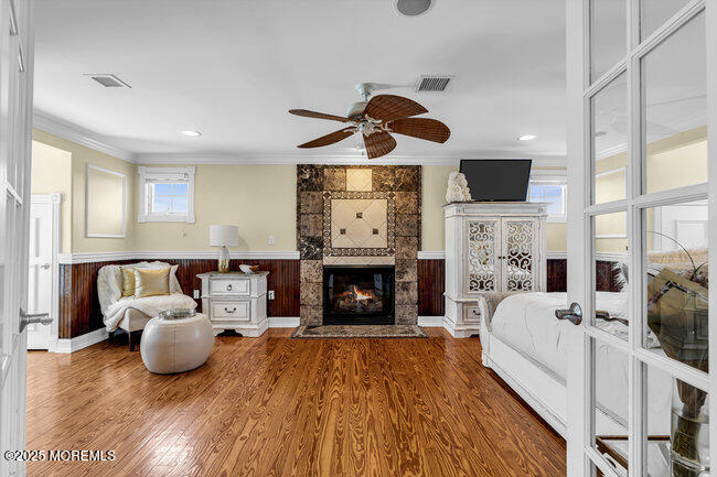 835 Anchor Drive Forked River, NJ 08731 - Photo 24 of 146 a living room with furniture a fireplace and a flat screen tv