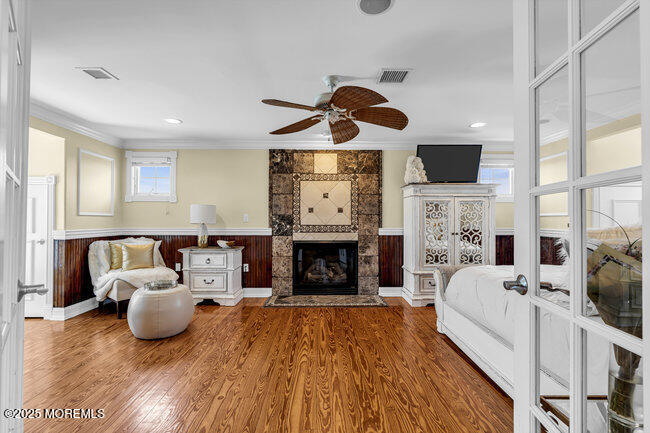 835 Anchor Drive Forked River, NJ 08731 - Photo 28 of 146 a living room with furniture a fireplace and a flat screen tv