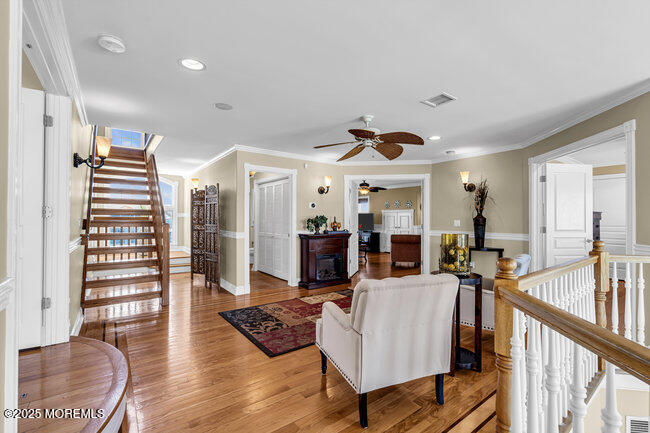 835 Anchor Drive Forked River, NJ 08731 - Photo 43 of 146 a living room with lots of furniture and a wooden floor