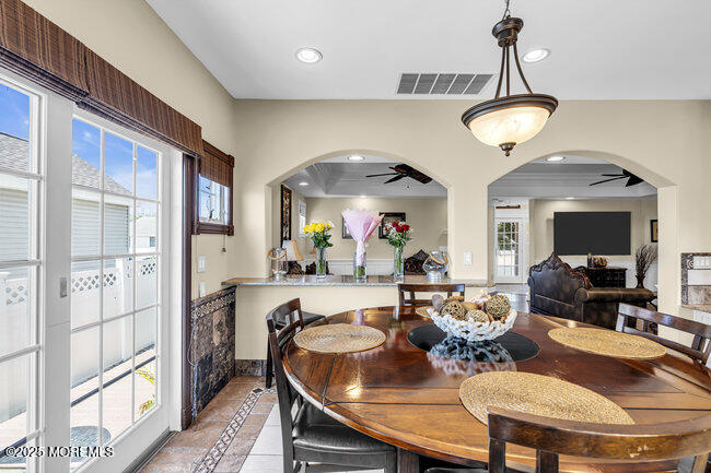 835 Anchor Drive Forked River, NJ 08731 - Photo 74 of 146 a view of a dining room with furniture a chandelier and wooden floor