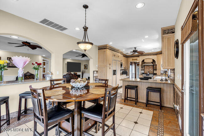 835 Anchor Drive Forked River, NJ 08731 - Photo 75 of 146 a view of a dining room with furniture window and wooden floor