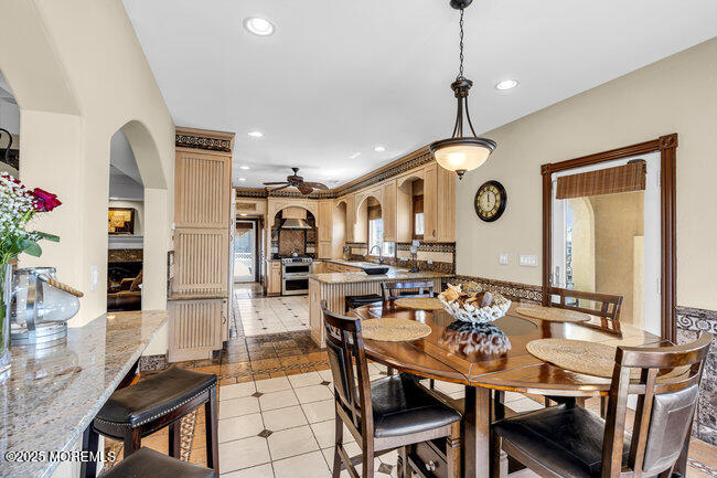 835 Anchor Drive Forked River, NJ 08731 - Photo 77 of 146 a view of a dining room with furniture and chandelier