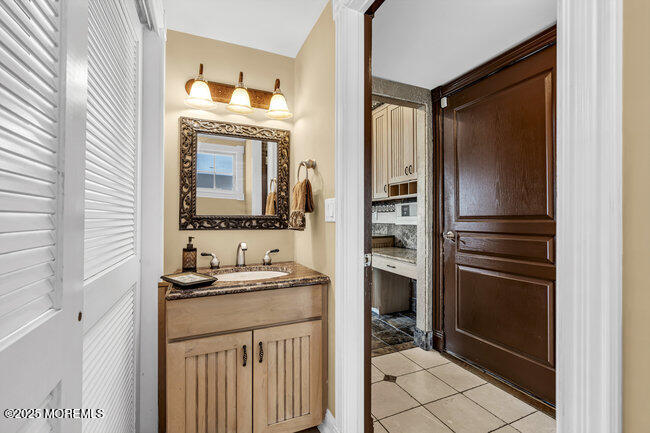 835 Anchor Drive Forked River, NJ 08731 - Photo 86 of 146 a bathroom with a sink a toilet and a mirror
