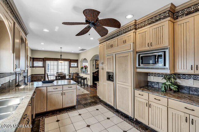 835 Anchor Drive Forked River, NJ 08731 - Photo 91 of 146 a kitchen with stainless steel appliances kitchen island granite countertop a sink and cabinets