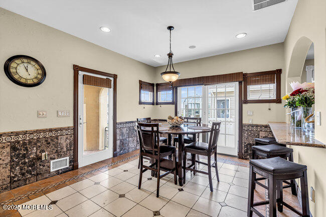 835 Anchor Drive Forked River, NJ 08731 - Photo 100 of 146 a view of a dining room with furniture window and wooden floor