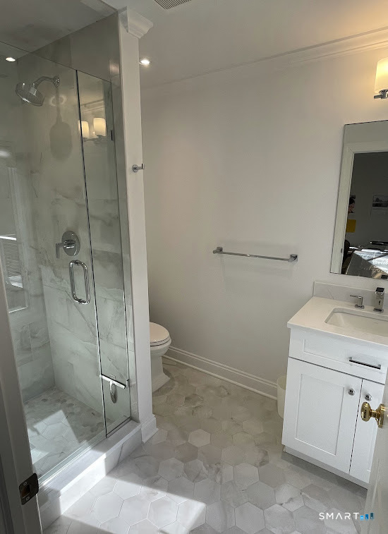 9 Tory Hole Road Darien, CT 06820 - Photo 20 of 33 a bathroom with a shower a toilet and sink