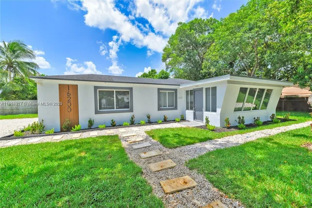 front view of a house with a yard