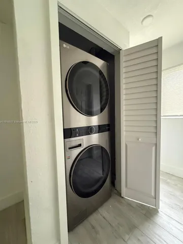 a view of a hallway with washer and dryer