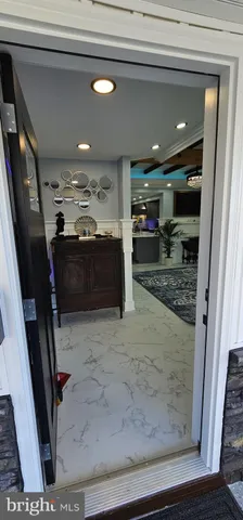 a bathroom with a glass door shower and a sink