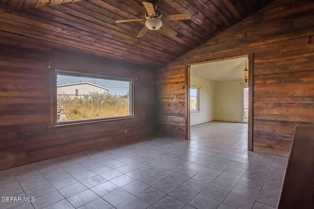 a view of a bathroom with a tub and window