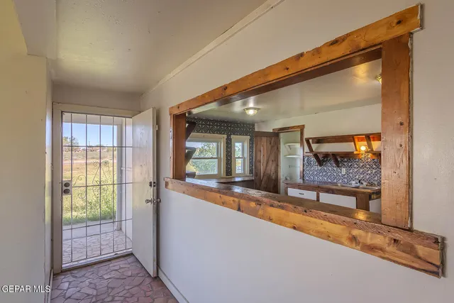 a view of hallway with wooden floor