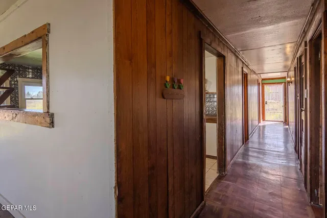 a kitchen with granite countertop a sink and cabinets