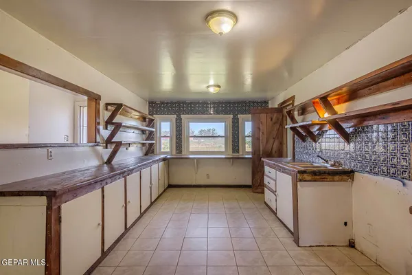 a view of a hallway with washer and dryer