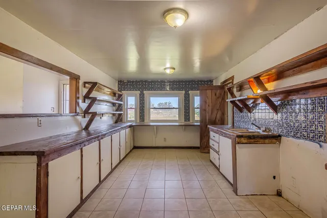 a view of a hallway with washer and dryer