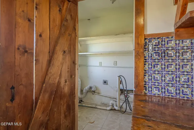 a large white kitchen with a window
