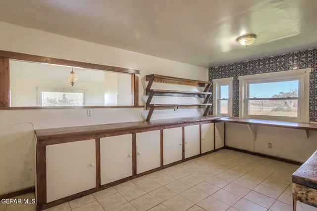 an empty room with closet area