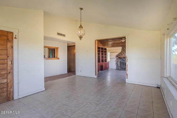 a view of a living room with a wooden floor