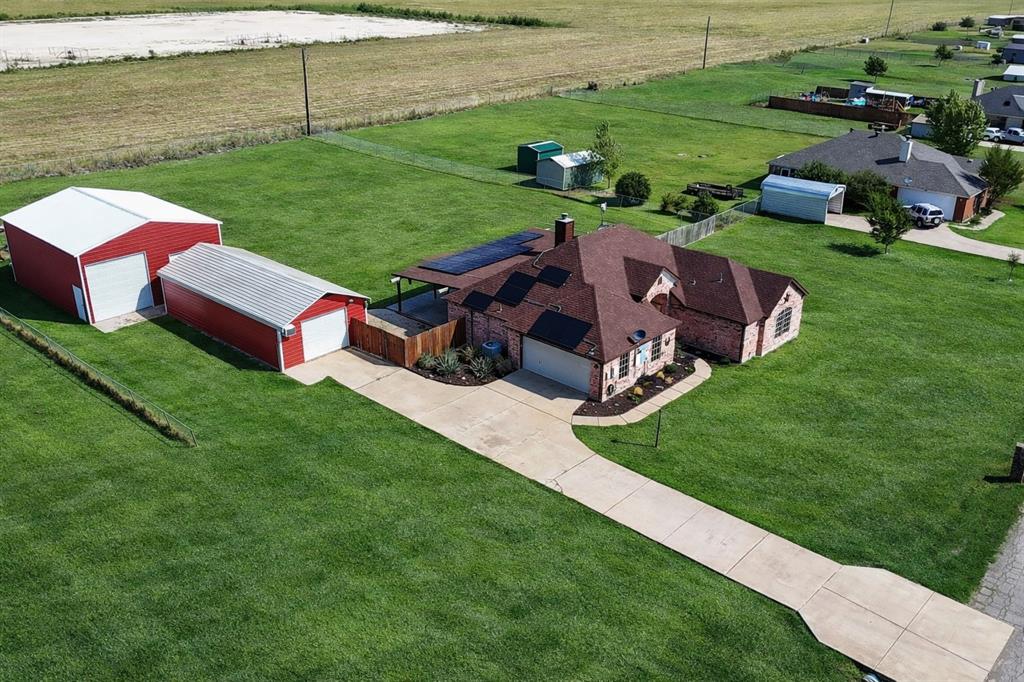 a view of a garden with lawn chairs