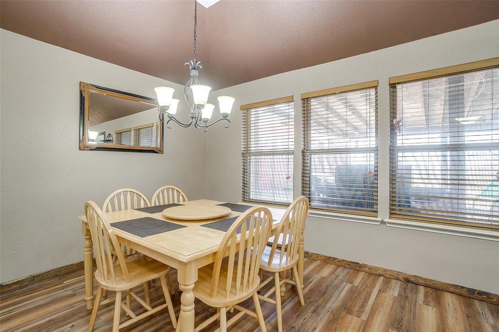 10905 Soft Shell Drive Venus, TX 76084 - Photo 14 of 21 a view of a dining room with furniture and chandelier