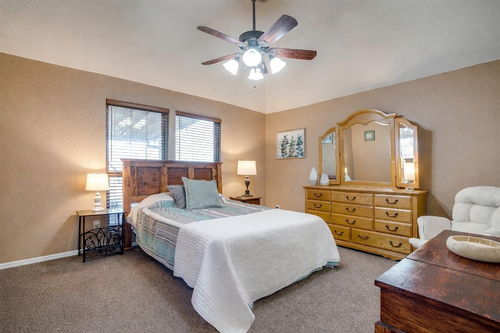 10905 Soft Shell Drive Venus, TX 76084 - Photo 15 of 21 a bedroom with a bed and furniture