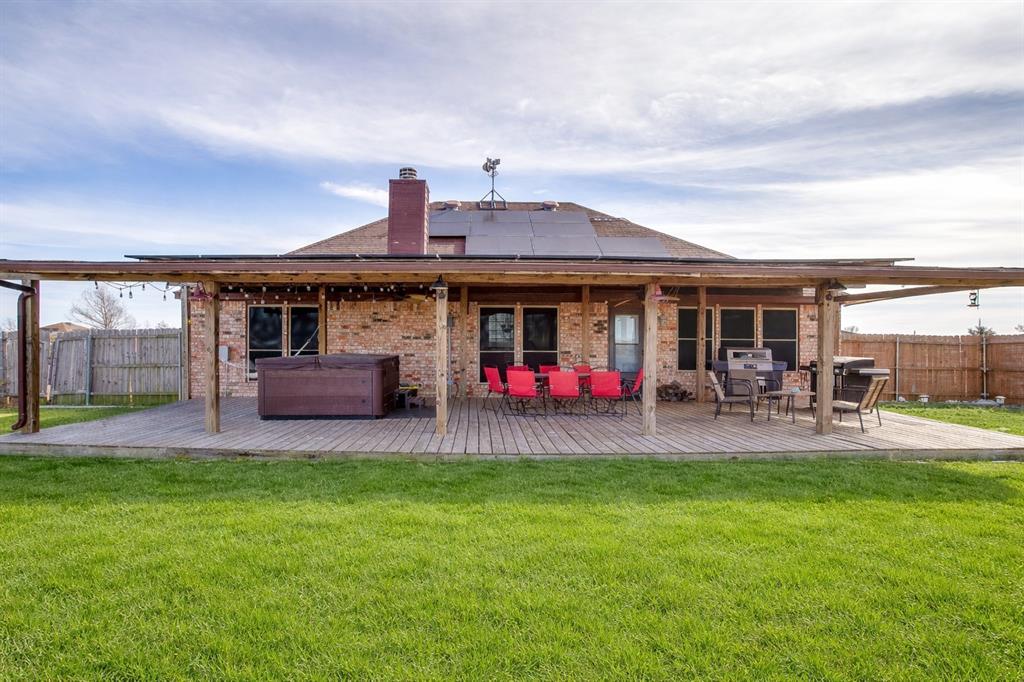 10905 Soft Shell Drive Venus, TX 76084 - Photo 6 of 21 a view of a house with a backyard porch and sitting area