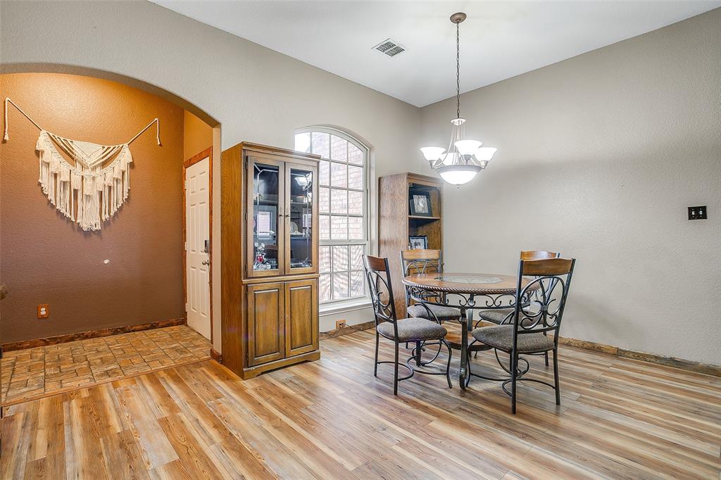 10905 Soft Shell Drive Venus, TX 76084 - Photo 10 of 21 a view of a dining room with furniture window and wooden floor